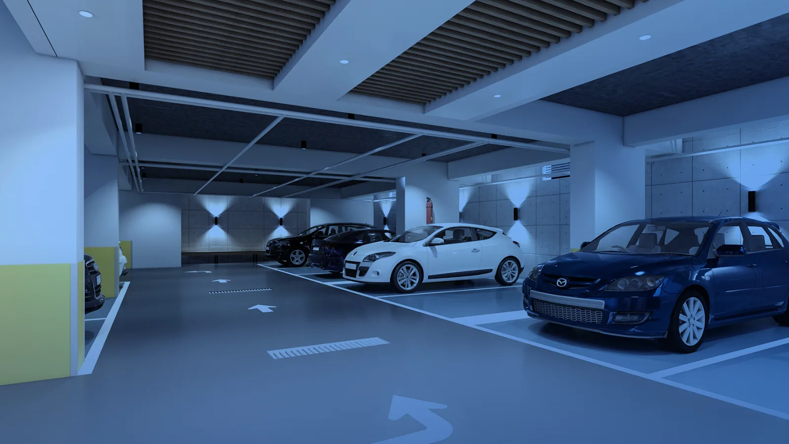 Estacionamiento interior moderno con vehículos estacionados